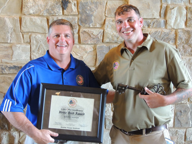 Dave Lieske (left) awards Adam Cassidy (right) with a house from the PGA Reach and Military Warriors at Colorado Golf Club