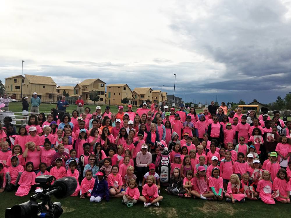 Paula Creamer takes a group photo at a girl's clinic on Monday