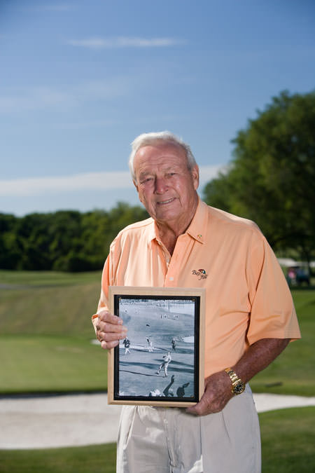 Arnold Palmer holds photograph of 1960 US Open