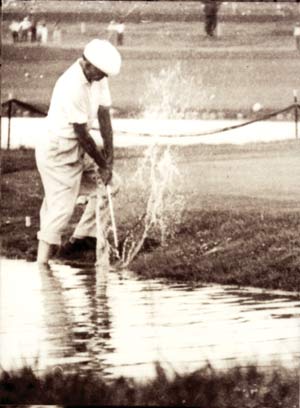 Ben Hogan hits out of the water, 17th hole Cherry Hills