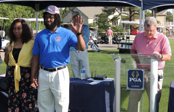 Darnell Harrison acknowledges applause after an introduction by Colorado PGA Executive Director Eddie Ainsworth.