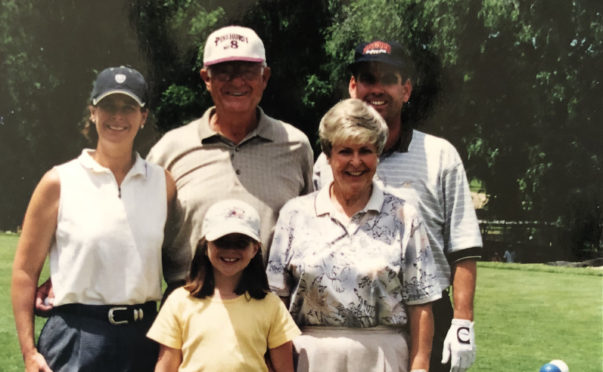 Janet Moore at the 2001 CGHOF tournament with parent Sub and Reta Ruma, husband Kent (far right) and daughter Sarah.