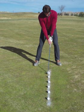 Golf drill, step 1: draw a in the grass with foot powder
