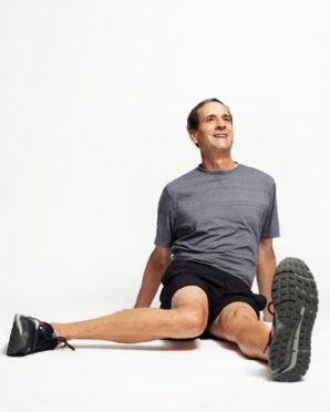 Robert Polk performs the piriformis stretch