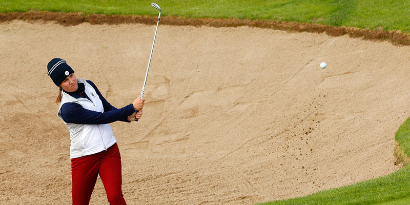 Jennifer Kupcho hits a shot from the bunker at the World Amateur Team Championship