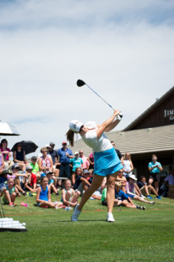 Hitting driver, Kupcho demonstrates her winning form for the audience.