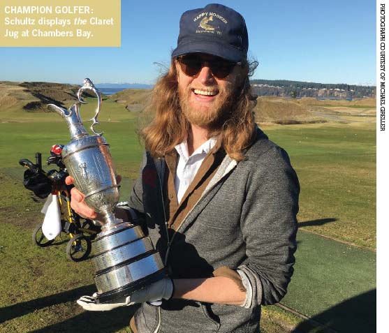 The Lumineer holding the Claret Jug at Chambers Bay.