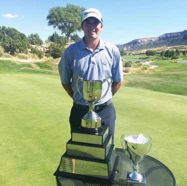 Ben Corfee and the Rocky Mountain Open trophy.