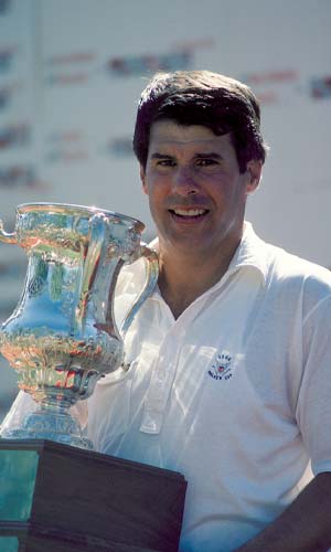 Jay Sigel holding a trophy.