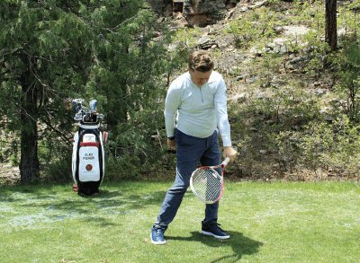 Alex Fisher demonstrates the second phase of a fade technique drill with a tennis racket. 