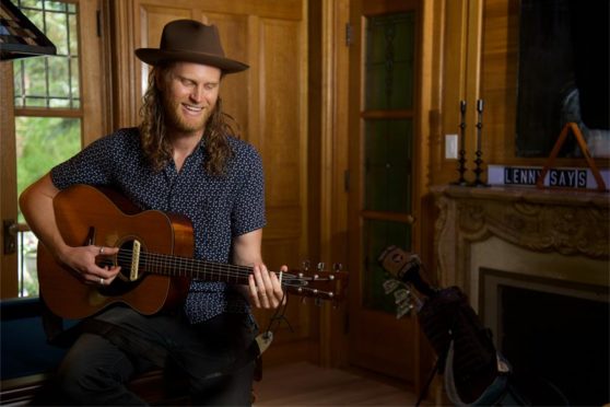 Wesley Schultz of The Lumineers jamming on the guitar