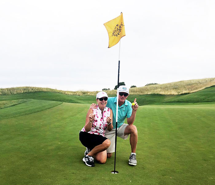 Mark Person and Patty Novosel-Person celebrate an ace at the Club at Pradera