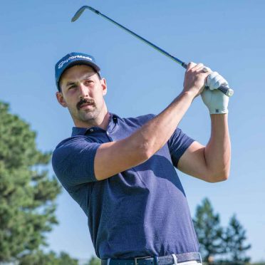 Broncos' placekicker Brandon McManus swings a golf club