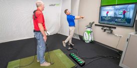 GOLFTEC teacher in a lesson with a student