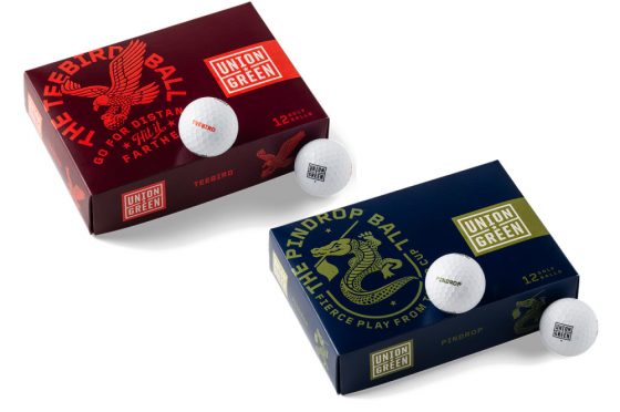 Two boxes of Union Green golf balls