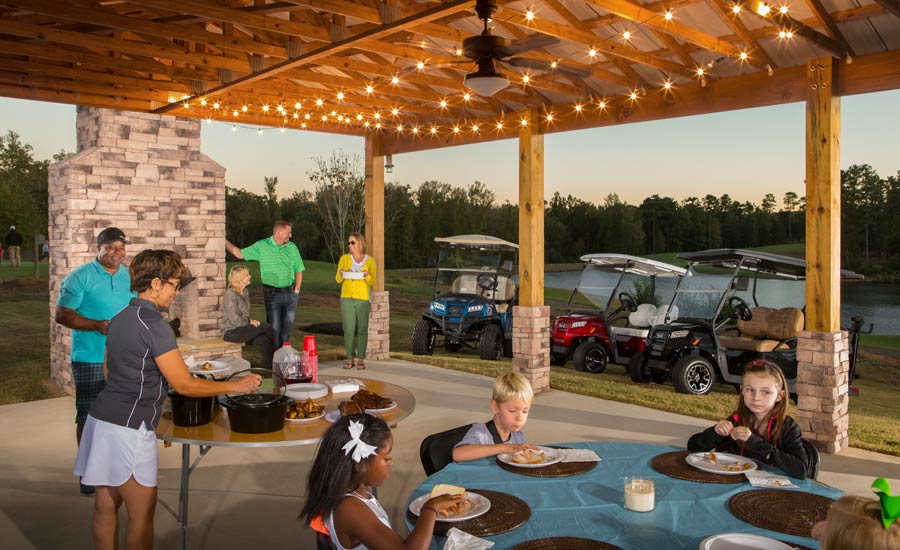 A cookout featuring several Club Car Onward models