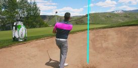 Hitting out of a greenside bunker.
