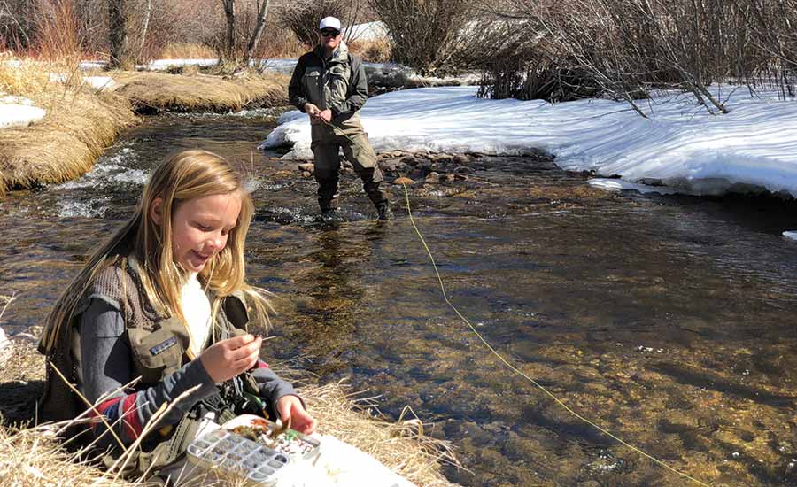 A father and daughter go fishing at Frost Creek