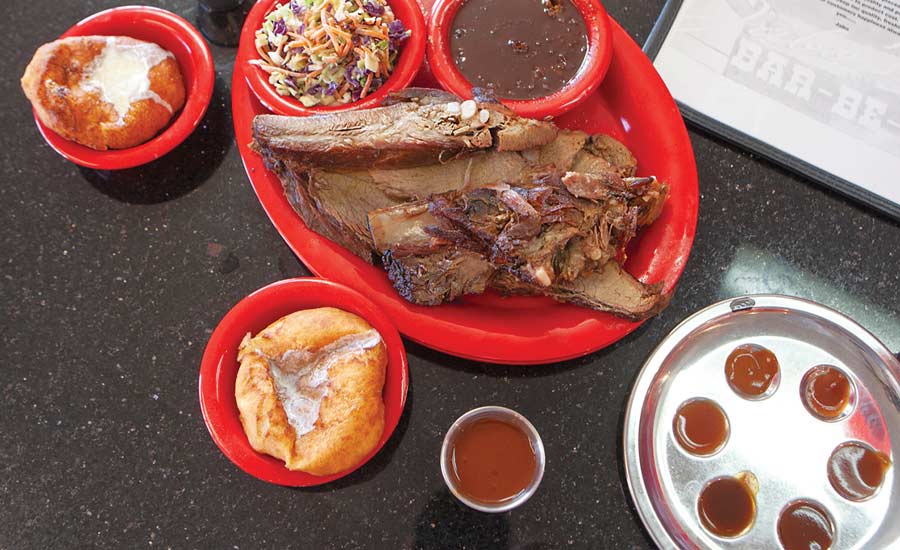 EYE ’CUE: Jabo’s rib-sticking Louisiana Bar-Be-Q pairs with its bbq beans and sinful sconuts