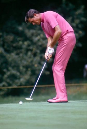 Doug Sanders dressed in an all pink outfit while out on the course.