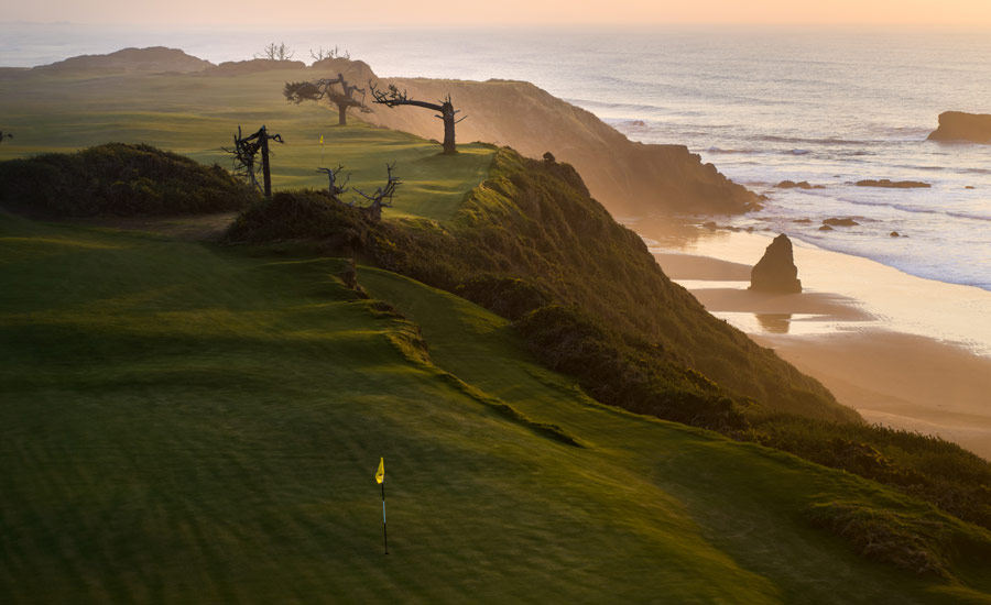 The first and 17th greens tightrope above the crashing surf.