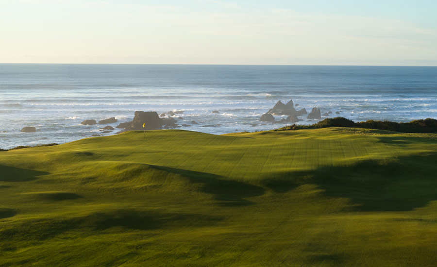 INTO THE WIND: A forgiving emerald expanse awaits on the par-3 fifth.