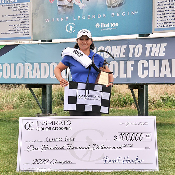 CLARISS GUCE POSES WITH TROPHY